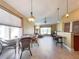Open-concept dining area with tile floors and bar with seating that flows into living spaces at 4721 Turnberry Cir, North Port, FL 34288