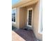 View of the front door with sidelights and brick pavers leading to the entrance on a sunny day at 4721 Turnberry Cir, North Port, FL 34288