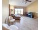 Comfortable living room with a view of the outdoors and tile floors at 4721 Turnberry Cir, North Port, FL 34288