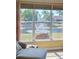 View from living room window overlooking a pond and fountain, bringing the outdoors in at 4721 Turnberry Cir, North Port, FL 34288