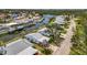 Aerial view of property showcasing waterfront living, lush landscaping, and neighborhood at 4821 Mount Vernon Dr # 4821, Bradenton, FL 34210