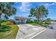 Charming single-story home featuring a well-maintained lawn, a driveway, and mature trees at 4821 Mount Vernon Dr # 4821, Bradenton, FL 34210