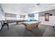 Bright game room features multiple pool tables, comfortable seating, and classic nautical themed decor at 4821 Mount Vernon Dr # 4821, Bradenton, FL 34210