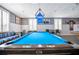 Inviting game room with a well-maintained pool table, comfortable seating, and nautical-themed decorations at 4821 Mount Vernon Dr # 4821, Bradenton, FL 34210
