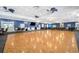 Spacious hall with elegant flooring, ample seating, and a vibrant blue accent wall with fan lighting fixtures at 4821 Mount Vernon Dr # 4821, Bradenton, FL 34210