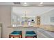 Open kitchen featuring an island with seating that overlooks the dining and living room at 4821 Mount Vernon Dr # 4821, Bradenton, FL 34210