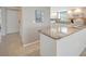 Bright kitchen with granite countertops and white cabinets at 4821 Mount Vernon Dr # 4821, Bradenton, FL 34210