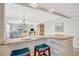 Kitchen island seating overlooking an open concept living and dining area at 4821 Mount Vernon Dr # 4821, Bradenton, FL 34210