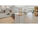 Open kitchen featuring an island, appliances, tile flooring and access to dining area and living room at 4821 Mount Vernon Dr # 4821, Bradenton, FL 34210