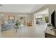 Inviting living room with neutral tones, tiled flooring, and comfortable seating arrangement at 4821 Mount Vernon Dr # 4821, Bradenton, FL 34210