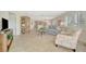 Bright and airy living room with a view of the dining area and comfortable furniture at 4821 Mount Vernon Dr # 4821, Bradenton, FL 34210