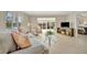 Comfortable living room featuring tile floors, plush seating, and scenic water views at 4821 Mount Vernon Dr # 4821, Bradenton, FL 34210