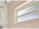 Tiled shower featuring rainfall showerhead and a window for natural light at 4821 Mount Vernon Dr # 4821, Bradenton, FL 34210