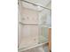 Modern shower with beige tiles, glass enclosure and stainless-steel fixtures at 4821 Mount Vernon Dr # 4821, Bradenton, FL 34210