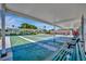 Covered shuffleboard court with green playing surfaces, benches, and shaded seating, perfect for recreational activities at 4821 Mount Vernon Dr # 4821, Bradenton, FL 34210