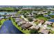 Panoramic aerial view of a lakeside residential community with lush green landscaping and beautiful homes at 4918 Avon Ln, Sarasota, FL 34238