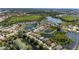 Expansive aerial view of a community with homes nestled along a network of serene lakes, surrounded by lush greenery at 4918 Avon Ln, Sarasota, FL 34238