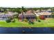 A screened-in pool is attached to the home and accessible from the expansive backyard and lakefront at 4918 Avon Ln, Sarasota, FL 34238