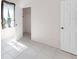 This bright bedroom features tile flooring and a window with view of the outside at 4918 Avon Ln, Sarasota, FL 34238