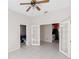 Open bonus room with tile flooring features French doors leading to a bathroom and the kitchen at 4918 Avon Ln, Sarasota, FL 34238