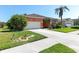 Beautiful single-story home with a manicured front yard and attached two car garage at 4918 Avon Ln, Sarasota, FL 34238