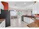 This kitchen features white cabinets, granite countertops, and stainless steel appliances at 4918 Avon Ln, Sarasota, FL 34238