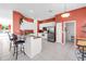 Bright kitchen with stainless steel appliances, granite countertops, and a breakfast bar with seating at 4918 Avon Ln, Sarasota, FL 34238