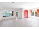 The spacious living room boasts lots of natural light, tile floors, and views of the lake at 4918 Avon Ln, Sarasota, FL 34238