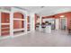 Living room featuring custom built-ins, breakfast bar and tile floors at 4918 Avon Ln, Sarasota, FL 34238