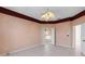 Spacious main bedroom featuring tile floors, ceiling fan, and connecting main bathroom at 4918 Avon Ln, Sarasota, FL 34238