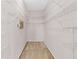 Spacious walk-in closet provides ample storage with its wall-to-wall metal shelving system at 4918 Avon Ln, Sarasota, FL 34238
