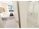 Modern bath and shower in view from the main bedroom for a spacious primary suite at 4950 Remington Dr # 304, Sarasota, FL 34234
