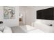 Comfortable bedroom with a TV, abstract art, and a view into the kitchen at 4950 Remington Dr # 304, Sarasota, FL 34234
