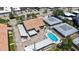 Aerial view of community with a refreshing pool, carports, and serene surroundings at 525 Barcelona Ave # 207, Venice, FL 34285