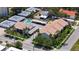 The aerial view showcases the property's layout, landscaping, parking, and a refreshing pool at 525 Barcelona Ave # 207, Venice, FL 34285