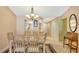 Dining area with dining table and view of the kitchen at 525 Barcelona Ave # 207, Venice, FL 34285
