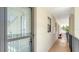 Welcoming entryway features neutral walls, a welcome sign and a view of the balcony at 525 Barcelona Ave # 207, Venice, FL 34285
