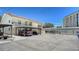 A well-maintained exterior with covered parking and lush landscaping at 525 Barcelona Ave # 207, Venice, FL 34285