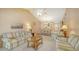 Open-concept living and dining area features comfortable seating and stylish decor at 525 Barcelona Ave # 207, Venice, FL 34285