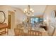 Open-concept living and dining area with comfortable seating and lots of natural light at 525 Barcelona Ave # 207, Venice, FL 34285