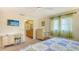 Inviting main bedroom with a ceiling fan, a desk, and an ensuite bathroom at 525 Barcelona Ave # 207, Venice, FL 34285