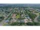 An elevated view features a community with ponds and mature landscaping at 5355 Anthony Ln, Sarasota, FL 34233