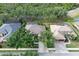 Aerial view of the home showcasing mature trees, and well-maintained landscaping at 5355 Anthony Ln, Sarasota, FL 34233