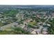 Aerial view showcasing a neighborhood layout with mature landscaping and community ponds at 5355 Anthony Ln, Sarasota, FL 34233