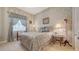 Tranquil bedroom featuring soft colors, floral accents, and a peaceful atmosphere at 5355 Anthony Ln, Sarasota, FL 34233
