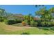 Well-maintained home exterior surrounded by lush landscaping, showcasing a serene outdoor space at 5355 Anthony Ln, Sarasota, FL 34233