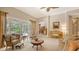 Relaxing living room showcases classic décor, outdoor views, and seamless indoor-outdoor living at 5355 Anthony Ln, Sarasota, FL 34233