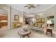 Charming living room featuring a piano, classic furniture, and a seamless transition to other spaces at 5355 Anthony Ln, Sarasota, FL 34233