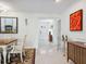 Bright dining area featuring neutral walls, tile floors, and adjacent living spaces at 5432 Cape Leyte Dr, Sarasota, FL 34242