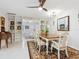 Open dining area features hardwood floors, neutral walls, and built-in shelving at 5432 Cape Leyte Dr, Sarasota, FL 34242